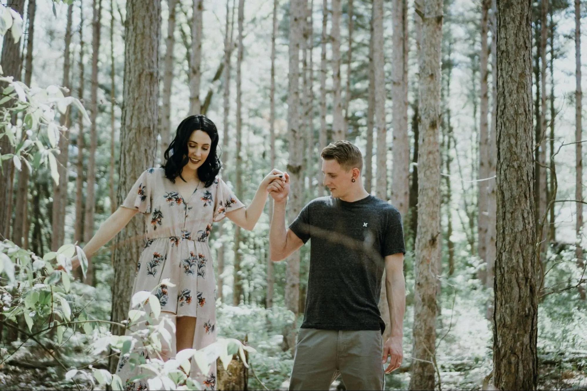 A couple enjoying a leisurely walk in the forest