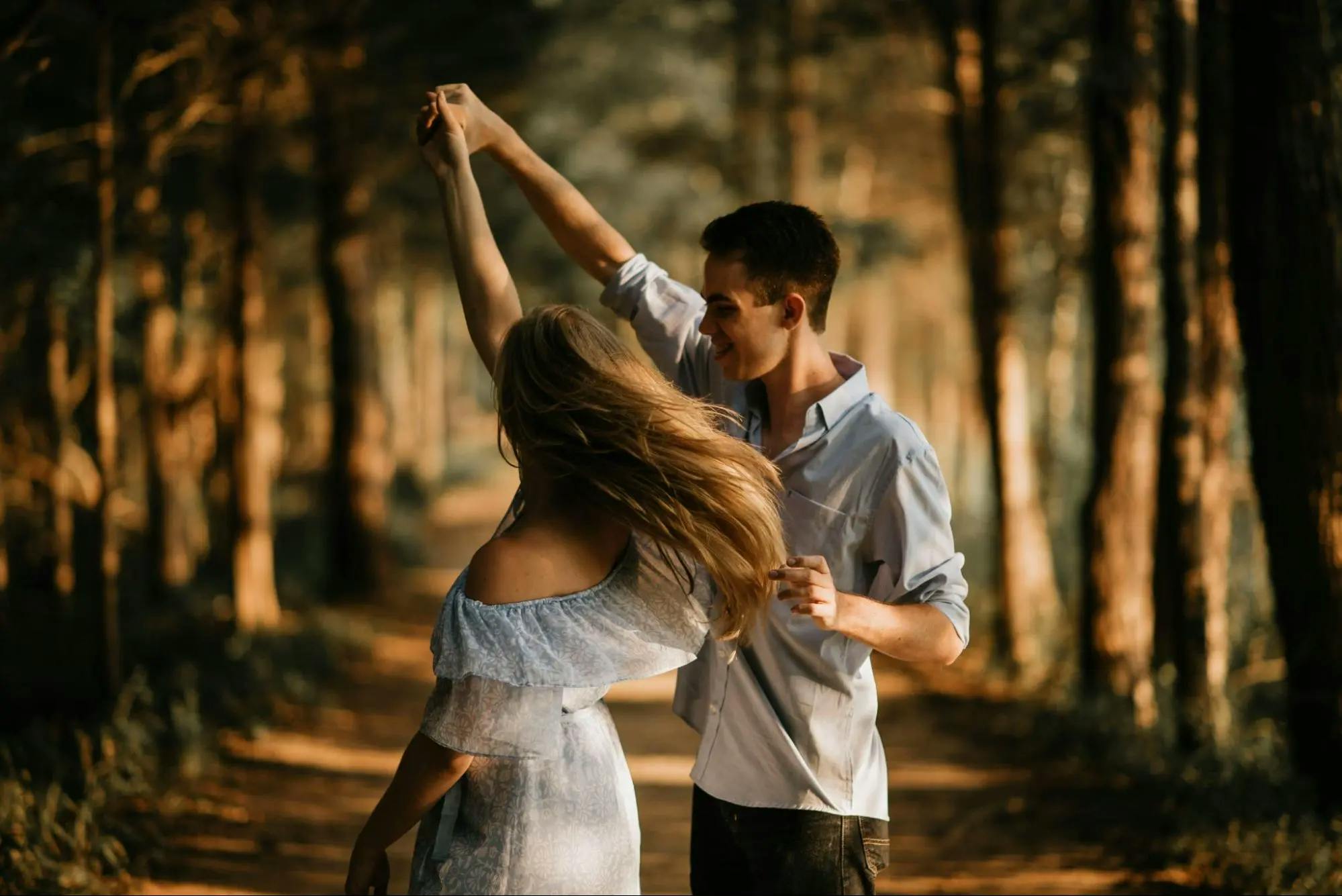 Couple dancing in a beautiful forest