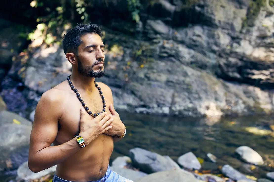 Man doing yoga in nature