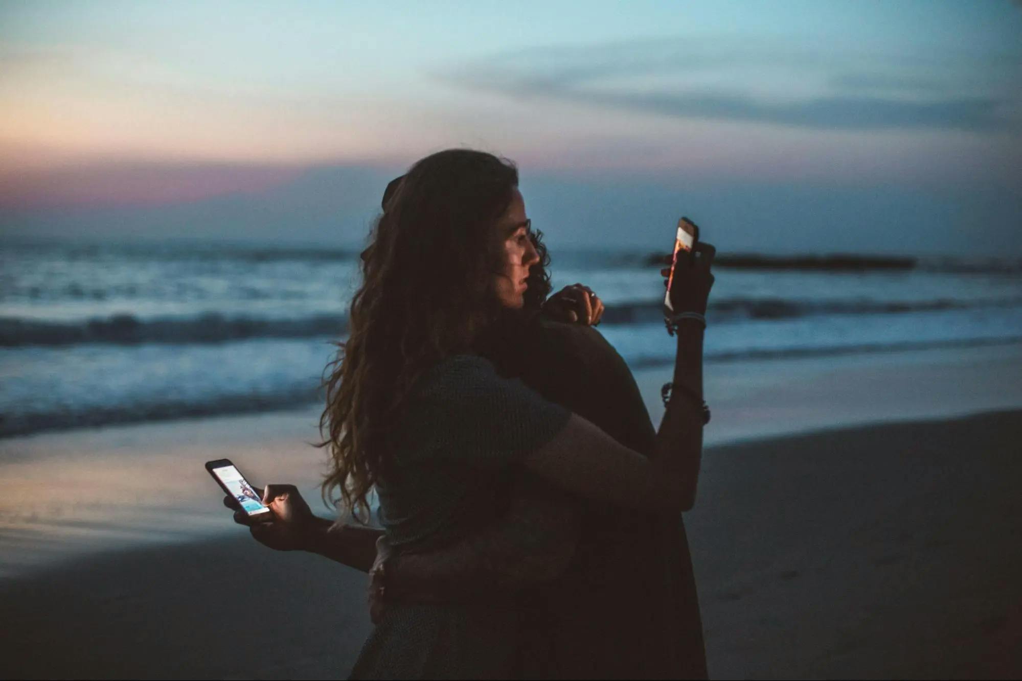 Couple paying attention to their phones instead of each other