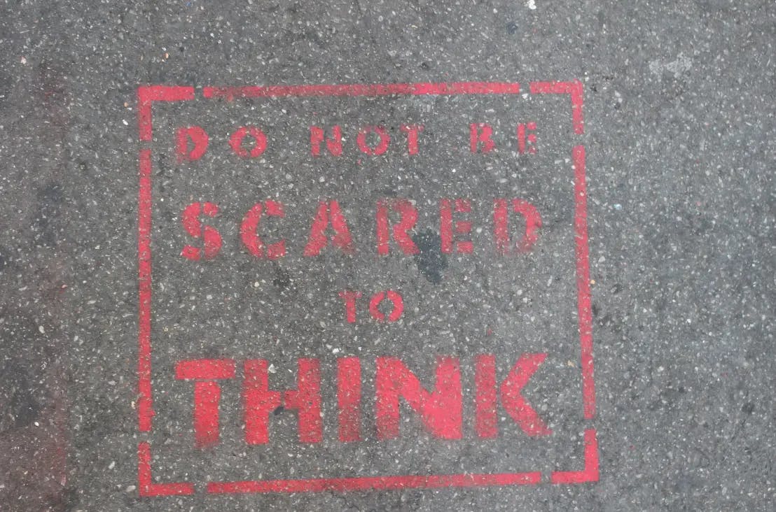 A quote that says "Do not be scared to think"