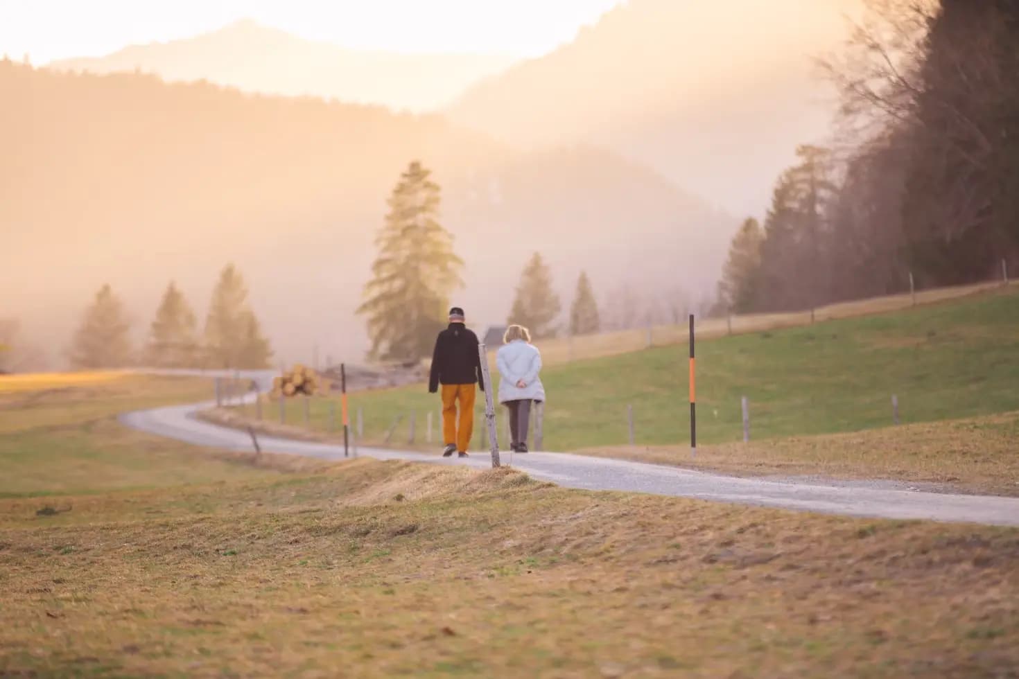 An old couple taking a stroll in a park