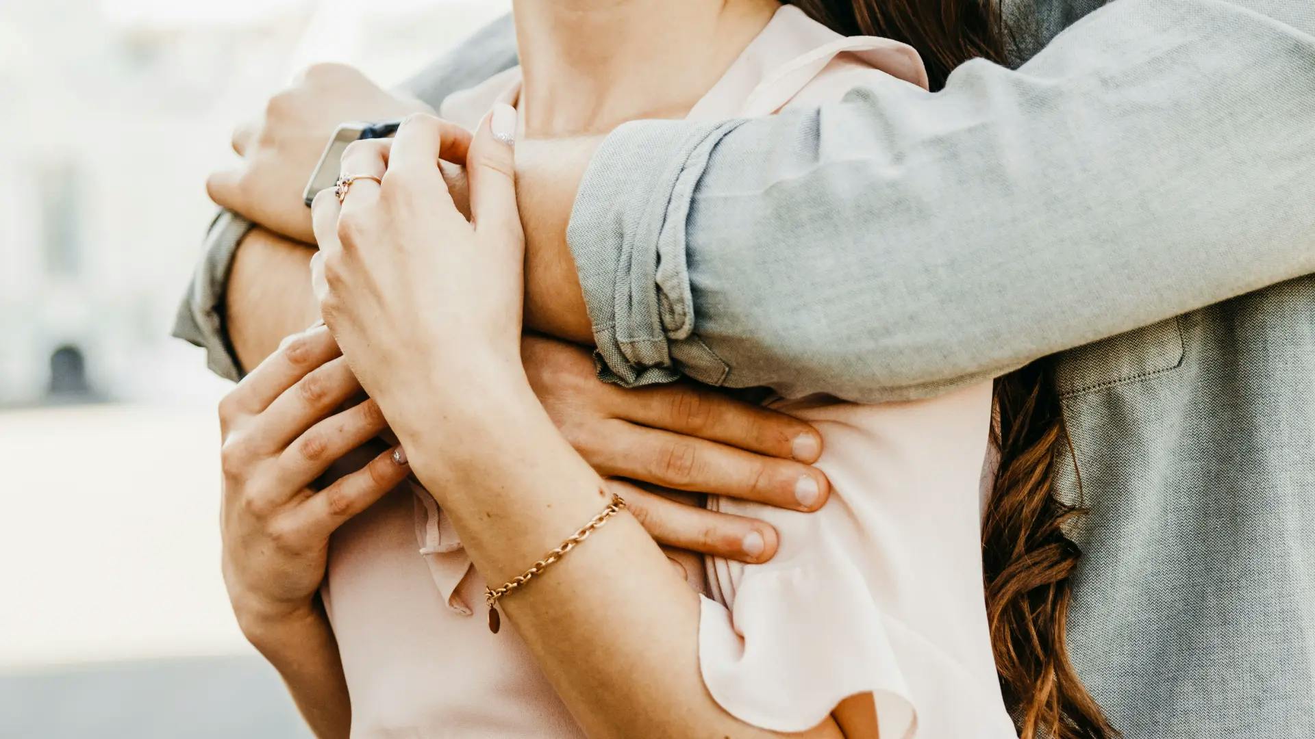 Boyfriend giving his girlfriend a back hug