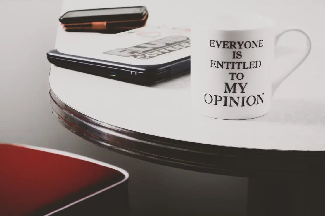 A mug with a quote placed on a table