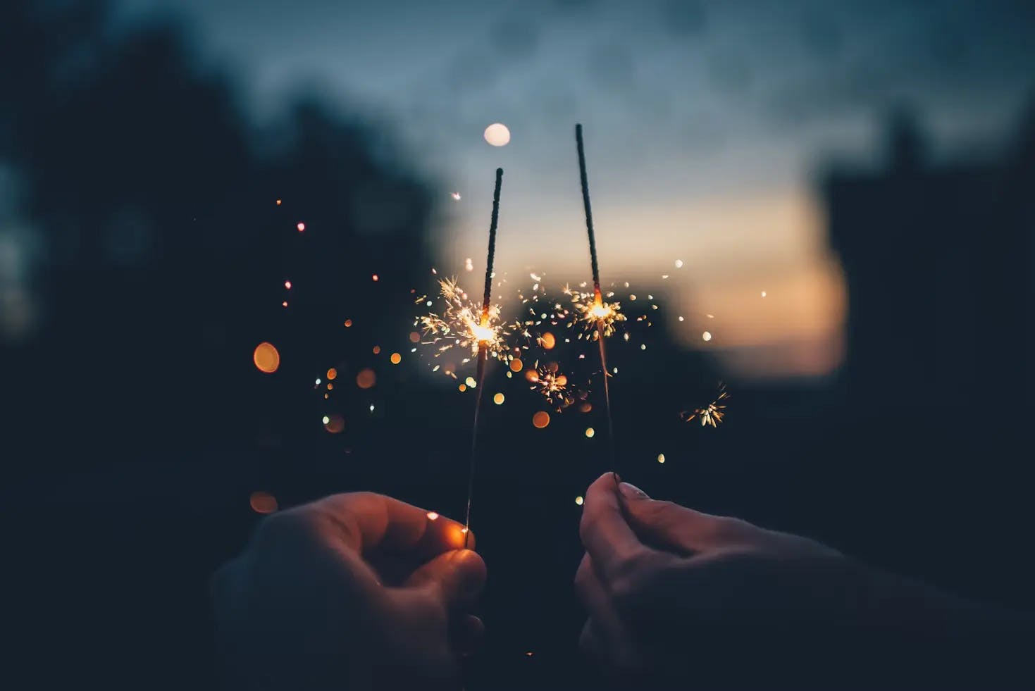 Couple holding sparklers